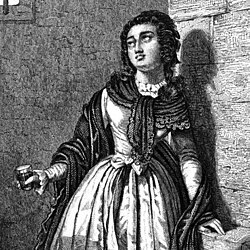 Sombreuil holding a glass of blood